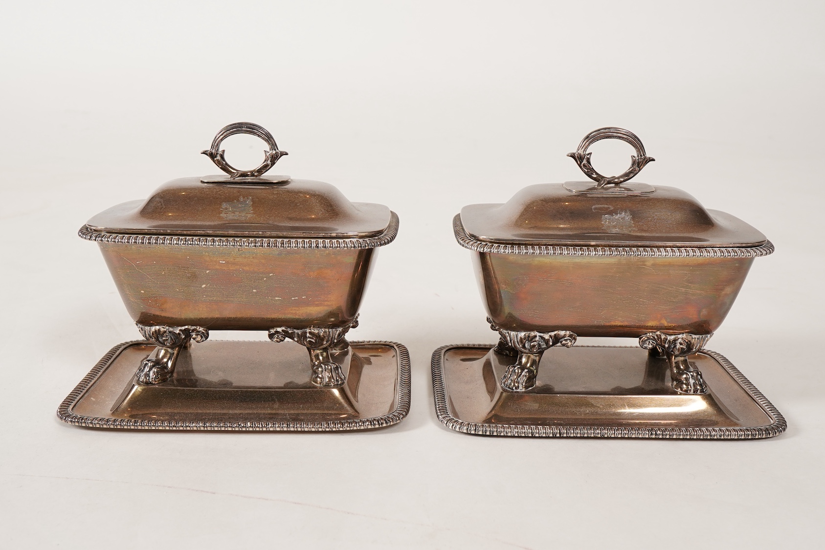 A pair of George IV silver sauce tureens with covers and integral stands, by Philip Rundell